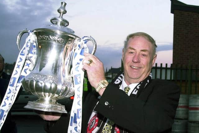 George poses with the FA Cup during his time as Darlington chairman