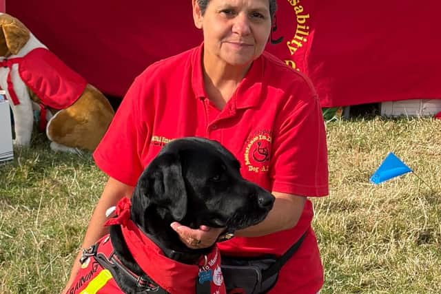 Leonie Zacharias is pictured with Nelson, who has successfully completed his final assessment and is now a fully qualified assistance dog.