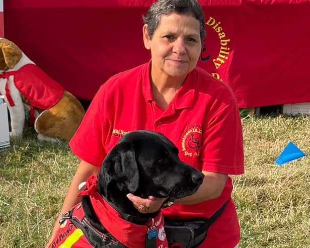 Leonie Zacharias is pictured with Nelson, who has successfully completed his final assessment and is now a fully qualified assistance dog.