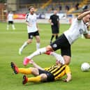 Alex Nicholson of Gateshead is fouled by Luke Shiels of Boston leading to a penalty during the Vanarama National League North Play-Off Semi-final match between Boston United and Gateshead at  on July 25, 2020 in Boston, England. (Photo by Alex Pantling/Getty Images)