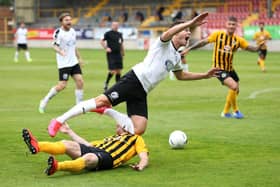 Alex Nicholson of Gateshead is fouled by Luke Shiels of Boston leading to a penalty during the Vanarama National League North Play-Off Semi-final match between Boston United and Gateshead at  on July 25, 2020 in Boston, England. (Photo by Alex Pantling/Getty Images)