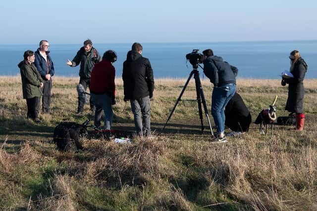 The team films at Blast Beach - l-r Desmond Consitt, Stephen Williams-Dixon, Prof. Dave Roberts and crew members William Smith, John Lewis, Hamza Mohammmed Alsarayreh and Leigh Alexander Crawford, with Professor Adelle Hulsmeier looking on. Photo: Colin Davison Photography