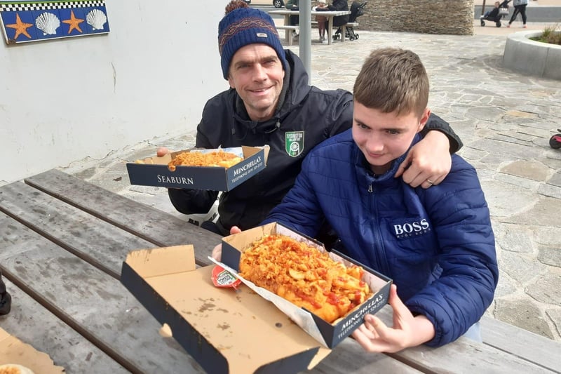 Tommy Atherton and son William Atherton enjoying their fish and chips.