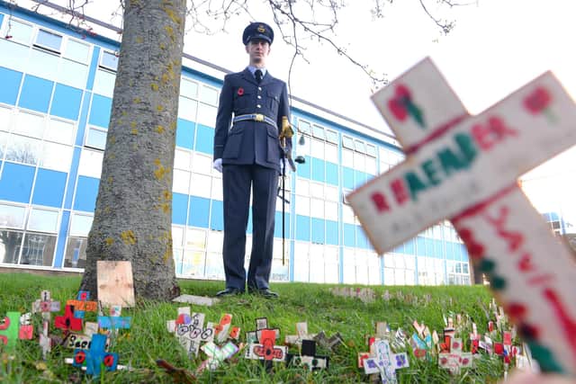 Former Monkwearmouth Academy student, RAF flight officer Harry Loraine, stands amongst some of the commemorative crosses made by Year 7 pupils.