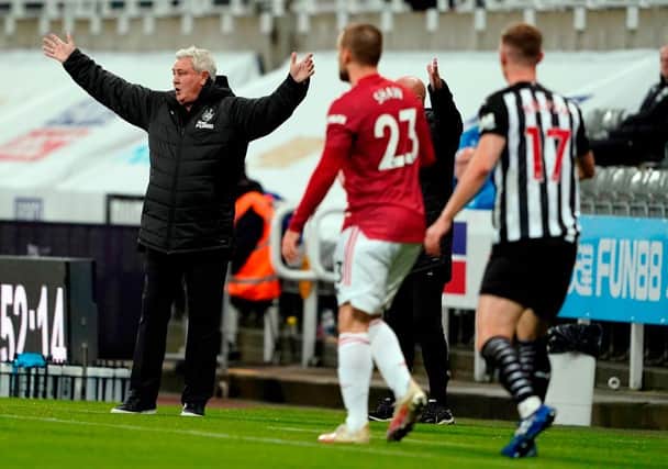 Newcastle United's English head coach Steve Bruce (L) reacts during the English Premier League football match between Newcastle United and Manchester United at St James' Park in Newcastle-upon-Tyne, north east England on October 17, 2020.