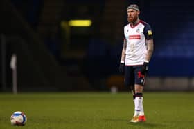 BOLTON, ENGLAND - MARCH 09: Marcus Maddison of Bolton Wanderers prepares to take a free kick during the Sky Bet League Two match between Bolton Wanderers and Cambridge United at University of Bolton Stadium on March 09, 2021 in Bolton, England. Sporting stadiums around the UK remain under strict restrictions due to the Coronavirus Pandemic as Government social distancing laws prohibit fans inside venues resulting in games being played behind closed doors. (Photo by Charlotte Tattersall/Getty Images)