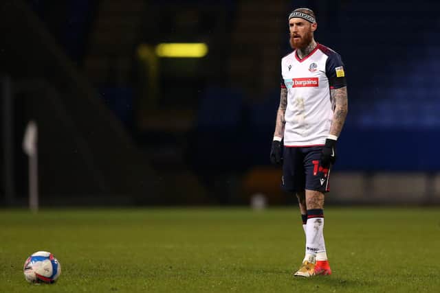 BOLTON, ENGLAND - MARCH 09: Marcus Maddison of Bolton Wanderers prepares to take a free kick during the Sky Bet League Two match between Bolton Wanderers and Cambridge United at University of Bolton Stadium on March 09, 2021 in Bolton, England. Sporting stadiums around the UK remain under strict restrictions due to the Coronavirus Pandemic as Government social distancing laws prohibit fans inside venues resulting in games being played behind closed doors. (Photo by Charlotte Tattersall/Getty Images)