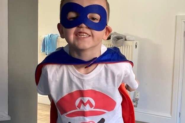 Jacob, age 5, dons his superhero gear for Comic Relief.