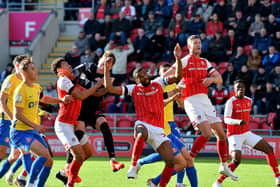 Rotherham and Sunderland players go for the ball.