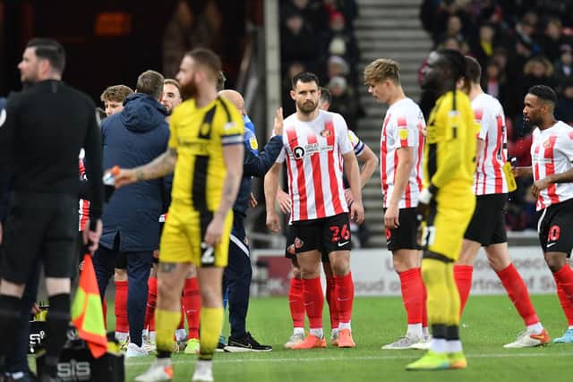 Players leaving the pitch at the Stadium of Light after the match was suspended to deal with a medical emergency.
