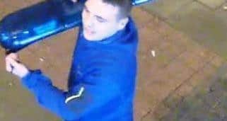 David Mcbeth was caught on camera walking away from the police car with a blue light on his shoulder.