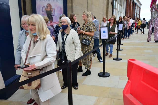 A queue of theatre goers waiting to enter the Empire Theatre as it re-opens after 18 months. Picture by FRANK REID.