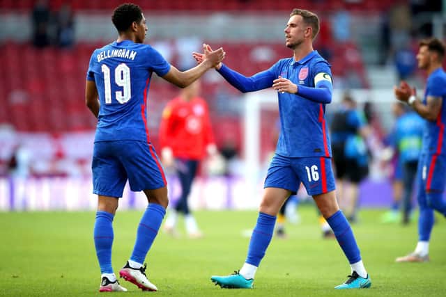 England's Jude Bellingham (left) and Jordan Henderson shake hands at the end of the international friendly match at Riverside Stadium, Middlesbrough. Picture by Nick Potts/PA Wire.