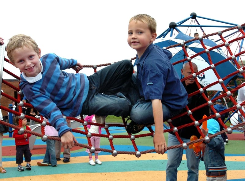 Mitchell McKellar, 7, and James Laws, 6, try out the swings in 2008.