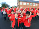 Children at New Seaham Academy giving a big thumbs up to the school's good Ofsted judgement.