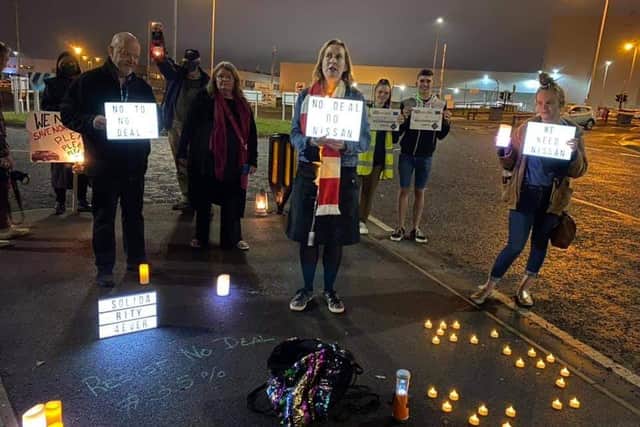 The group gathered with candles and banners as they called for the Government to rule out a no-deal scenario. Photo by Sylvia Zamperini.