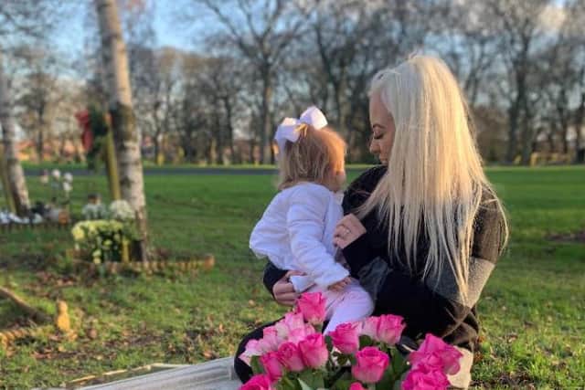 Jess King and her daughter Josie Rae Robinson at Josie's memorial in Bishopwearmouth Cemetary.