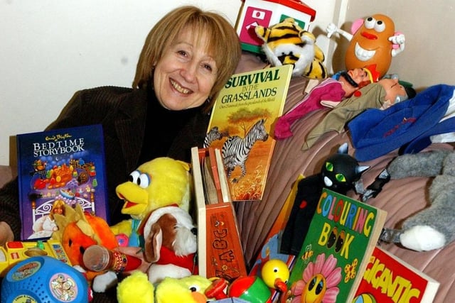 Here's a reminder of the day when the 4R's charity shop opened 19 years ago and Margaret Cobbold was having fun looking through a huge pile of toys.