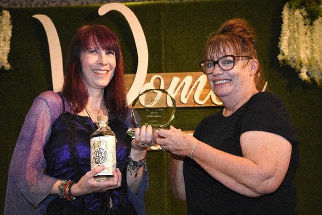 Kirsten Lapping (left) is presented with the Judges Choice Award at the 2019 Wearside Women in Business awards by Nicky Hudson, Director NE of UK Fostering. Picture by Ian McClelland