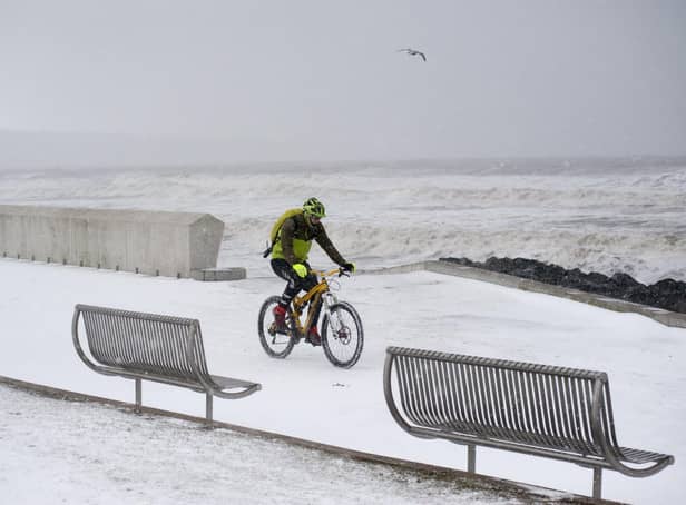 <p>A brave cyclist takes a trip along the Prom in Kirkcaldy during the ‘Beast from the East’ weather in February 2018.</p>