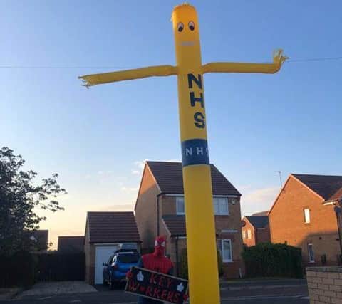 Spider-Man with the giant inflatable stick man support Clap for our Carers in Boldon Colliery.