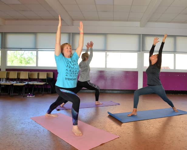 Julie Cook, right and her yoga class are keen to start again after months away. Picture bu Stu Norton.