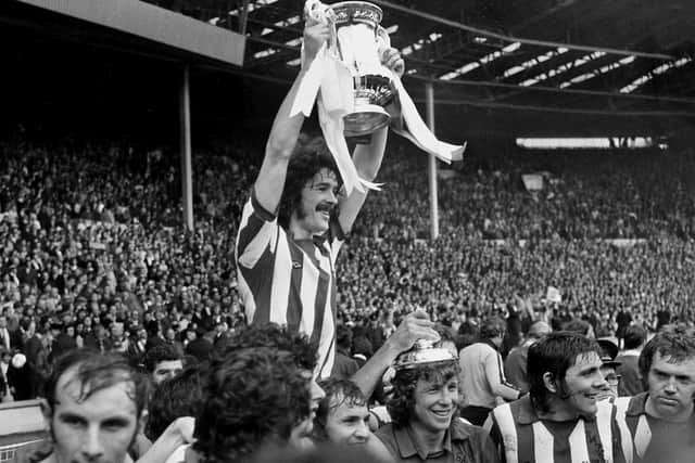 Sunderland captain Bobby Kerr holding the FA Cup at Wembley at the end of the 1973 final.