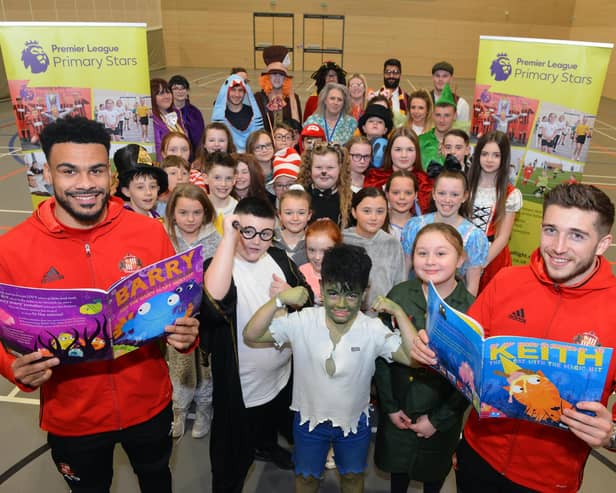 SAFC Foundation of Light supporting World Book Day with players Jordan Willis and Lynden Gooch (R)