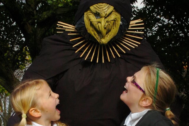 Kaitlin Hepple and Leah Fernandez look in awe at the Roald Dahl themed scarecrow which towered over them at Broadway Juniors in 2012.