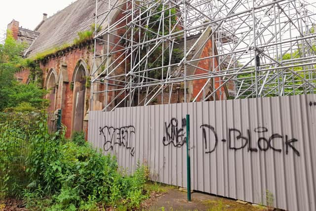 Temporary fencing around the chapel has been vandalised.