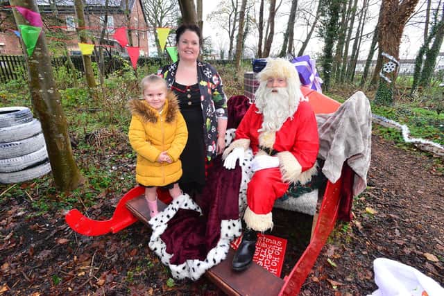 Teaching assistant Bev Quinn with pupil Ella Scott visit Santa Claus at the winter wonderland at Fatfield Academy, in Washington. Picture by FRANK REID
