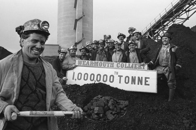 Faceworker Ian Mardghum with a shovel full of the millionth tonne of coal, watched by workmates from Wearmouth's G82 coalface in 1990. The pit was closed in 1993.