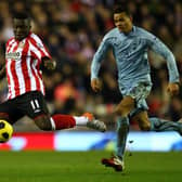 Sulley Muntari of Sunderland in action with Jermaine Jenas of Spurs during the Barclays Premier League match at the Stadium of Light on February 12, 2011.