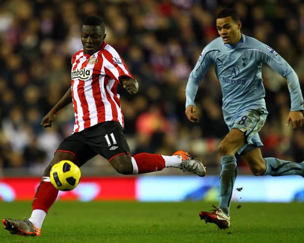 Sulley Muntari of Sunderland in action with Jermaine Jenas of Spurs during the Barclays Premier League match at the Stadium of Light on February 12, 2011.