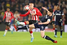 SOUTHAMPTON, ENGLAND - MARCH 02: Declan Rice of West Ham United battles for possession with Will Smallbone of Southampton during the Emirates FA Cup Fifth Round match between Southampton and West Ham United at St Mary's Stadium on March 02, 2022 in Southampton, England. (Photo by Warren Little/Getty Images)