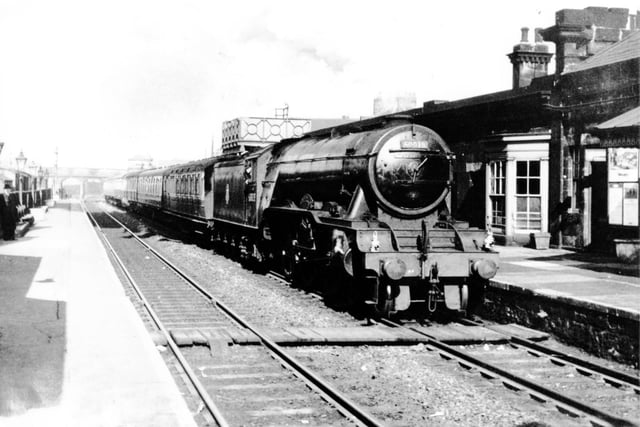 It's 1960 as LNER 60038 Class A3 Pacific stands at Monkwearmouth Station waiting for passengers on a day trip to York.
