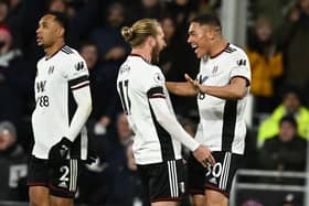 Carlos Vinicius celebrates after scoring for Fulham against Chelsea. (Photo by BEN STANSALL/AFP via Getty Images)