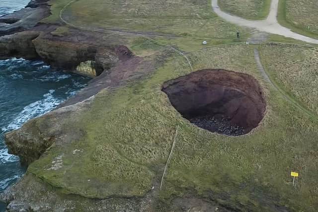 The sink hole is expected to continue to grow. (Photo by Davy Robson)