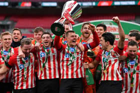 Max Power of Sunderland and teammates celebrate with the Papa John's Trophy at Wembley Stadium. (Photo by Justin Setterfield/Getty Images)