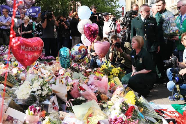 Tribute were left in St. Ann's Square, close to the Manchester Arena following the attack in May 2017. Photo: PA.
