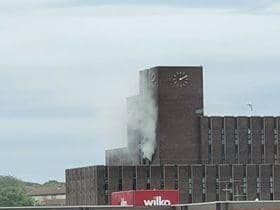 Smoke can be seen billowing from the seven storey building.

Photograph: Donna-Lou Rehtwol