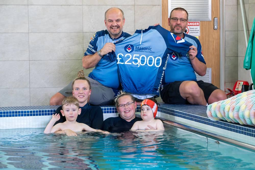 Gavin Rowell and Steve Piercy support Jenson and Elias with their hydrotherapy sessions along with staff members. Photo credit Keith Blundy.