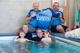 Gavin Rowell and Steve Piercy support Jenson and Elias with their hydrotherapy sessions along with staff members. Photo credit Keith Blundy.