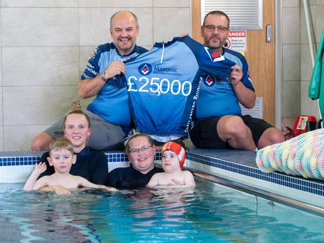 Gavin Rowell and Steve Piercy support Jenson and Elias with their hydrotherapy sessions along with staff members. Photo credit Keith Blundy.
