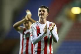 WIGAN, ENGLAND - SEPTEMBER 21: Nathan Broadhead of Sunderland interacts with the crowd following the Carabao Cup Third Round match between Wigan Athletic and Sunderland at DW Stadium on September 21, 2021 in Wigan, England. (Photo by Jan Kruger/Getty Images)