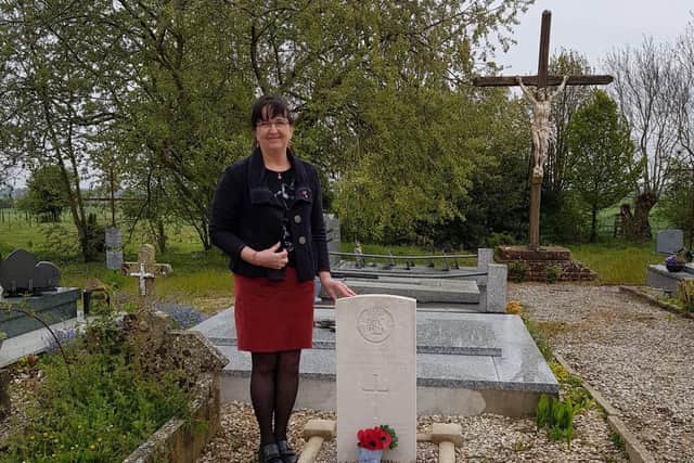 Regine Verguier at the graveside of Private Thomson.