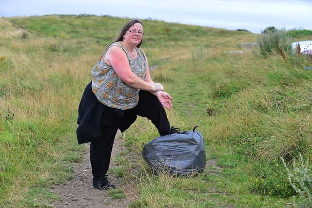 Hendon resident Lisa Coates, 55, with one of the bags of litter she collected. 

Picture by Frank Reid