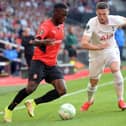 Rennes' Ghanaian forward Kamaldeen Sulemana (L) fights for the ball with Tottenham's Irish defender Matt Doherty  (Photo by JEAN-FRANCOIS MONIER/AFP via Getty Images)