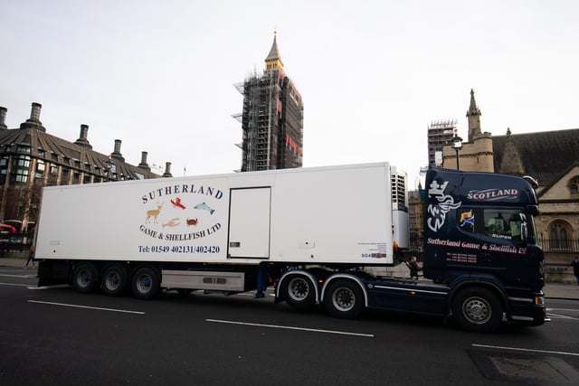 A lorry from Sutherland Game and Shellfish passes in front of the Houses of Parliament. Reports suggest that produce which has made it across the Channel has gone rotten by the time it arrived. (Aaron Chown)