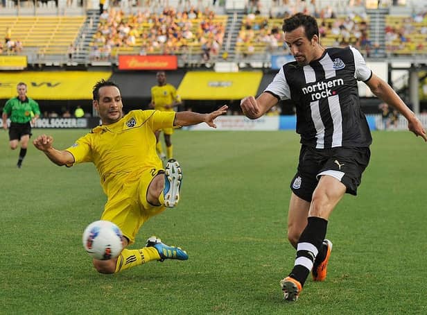 Sebastian Miranda #21 of the Columbus Crew attempts to stop a kick from Jose Enrique Sanchez #3 of Newcastle United FC on July 26, 2011 at Crew Stadium in Columbus, Ohio.   (Photo by Jamie Sabau/Getty Images)